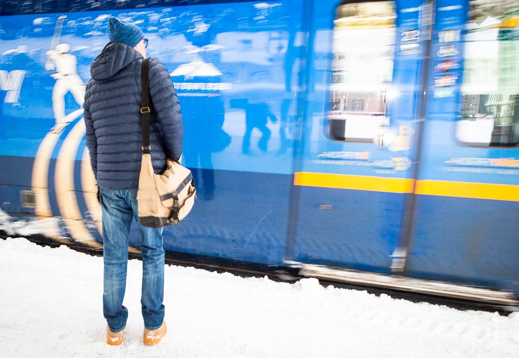 Man on platform by train